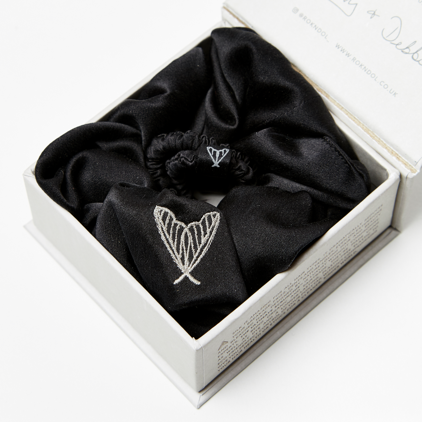 Black silk scrunchie and black silk hair tie in glossy black ethical silk