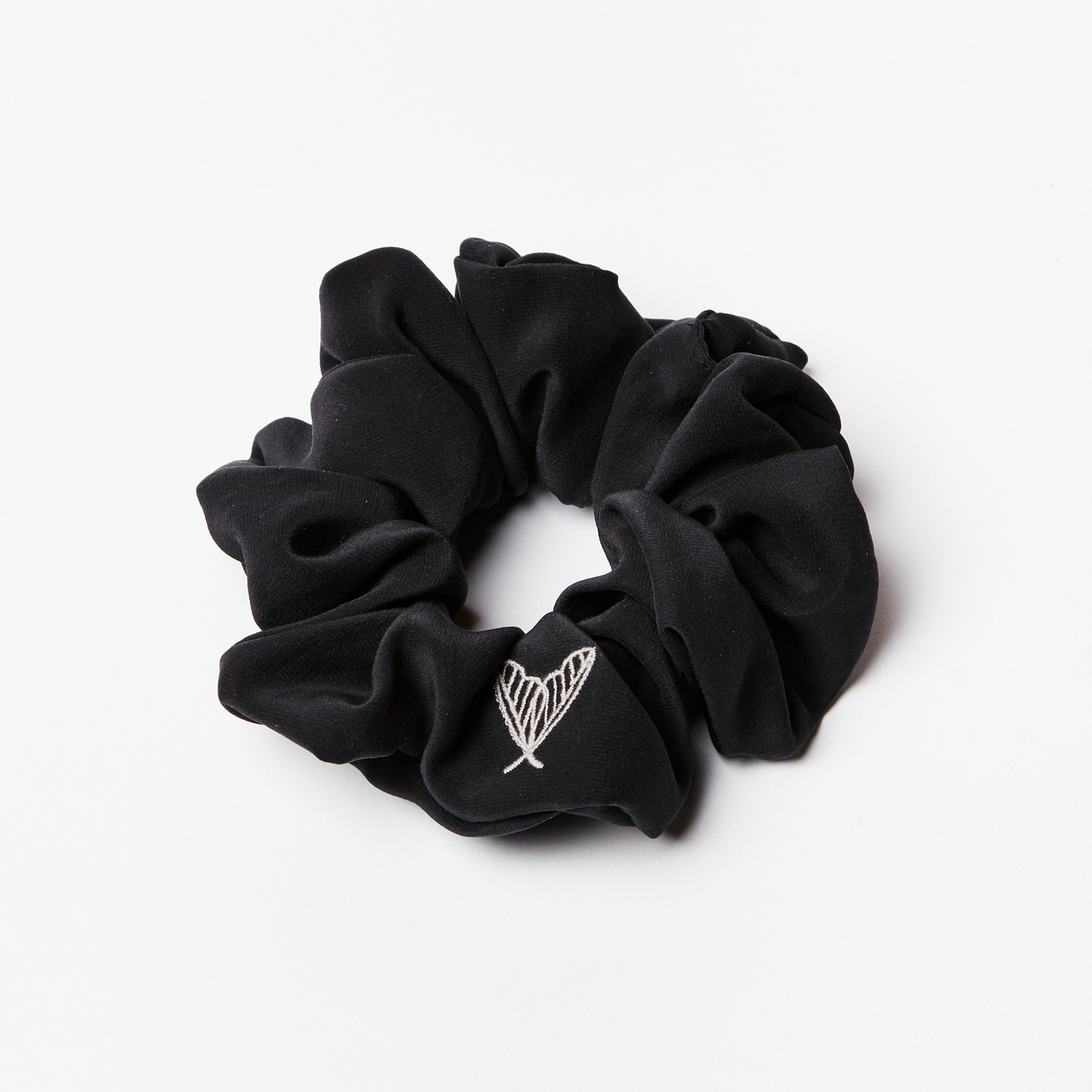 Large black silk scrunchie in matte black peace silk with ethical moth embroidery