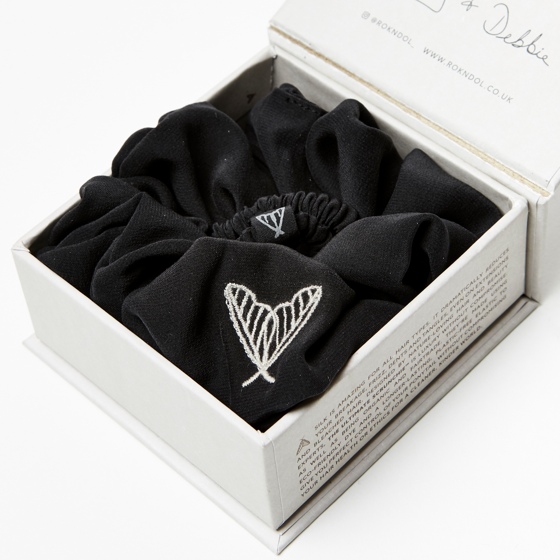 Black silk scrunchie and black silk hair tie in gift box, with matte silk finish