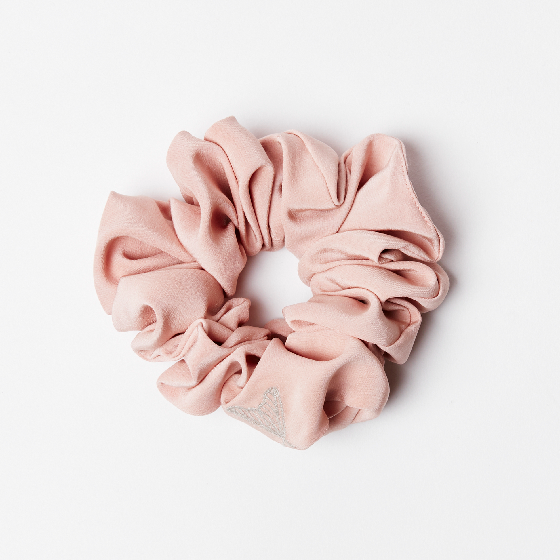 Pink silk scrunchie in matte pink silk with ethical moth embroidery