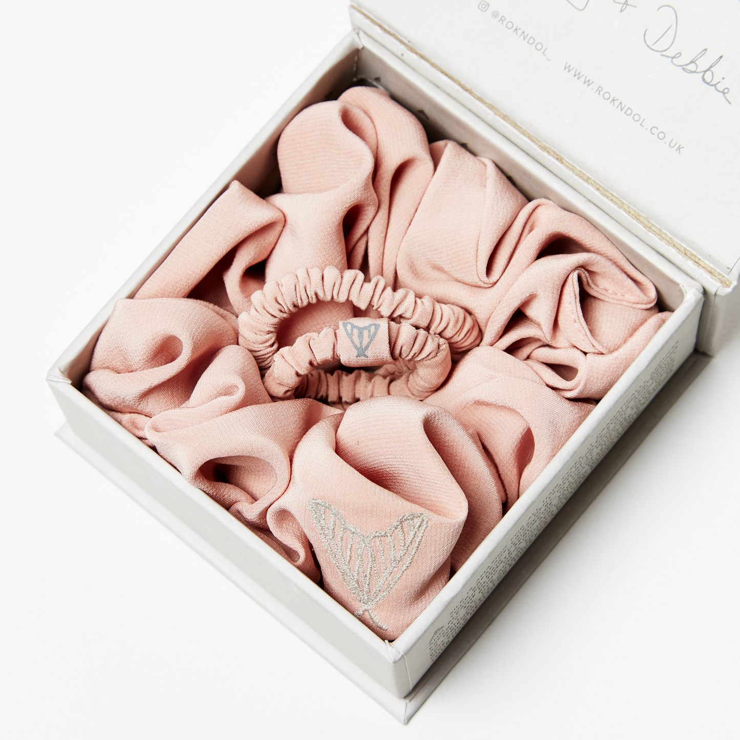 Pink silk scrunchie and pink silk hair tie in gift box, both in matte finish pink peace silk