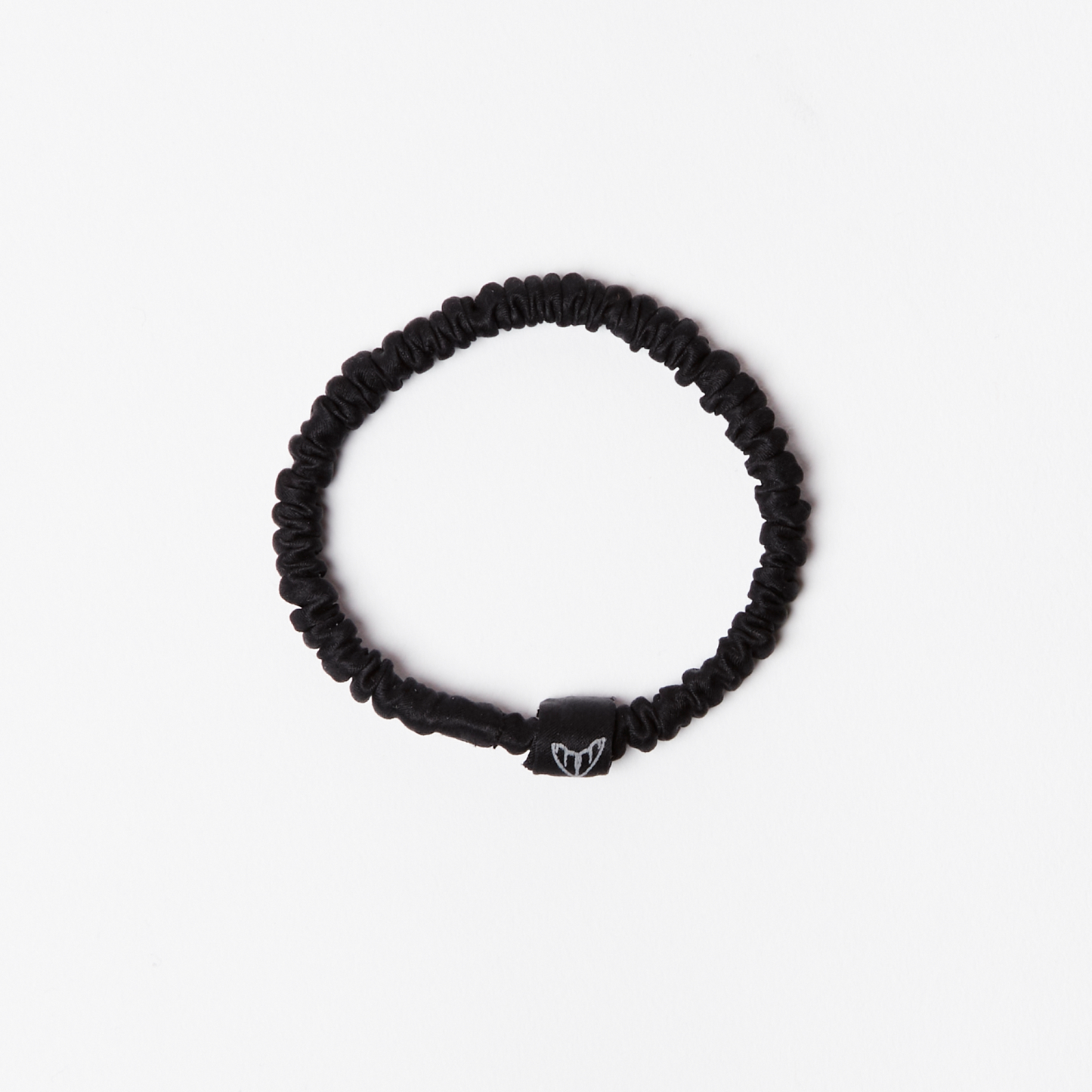 Black silk scrunchie hair tie in glossy black silk with ethical moth logo