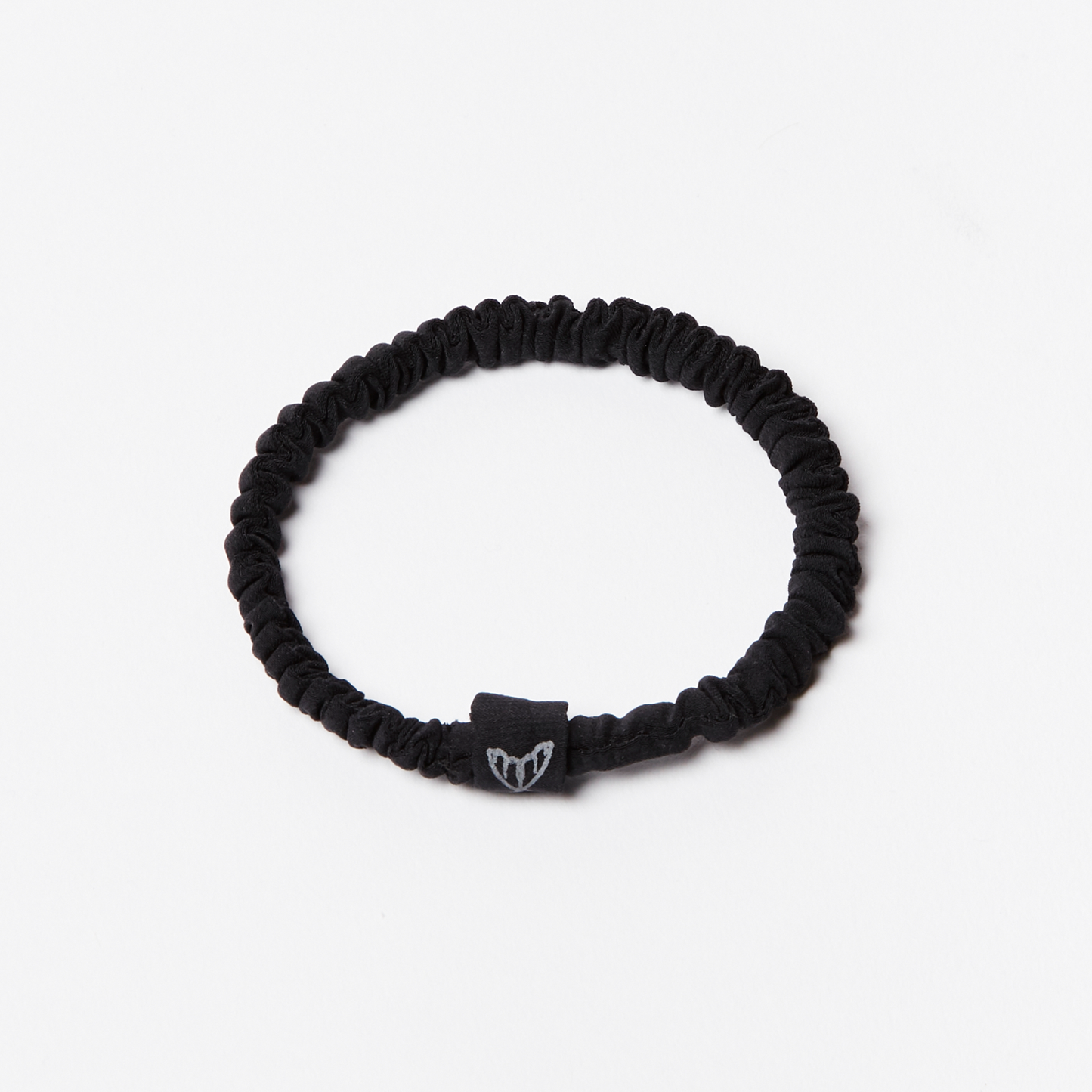 Black silk hair tie scrunchie made from ethical peace silk with cruelty free moth logo